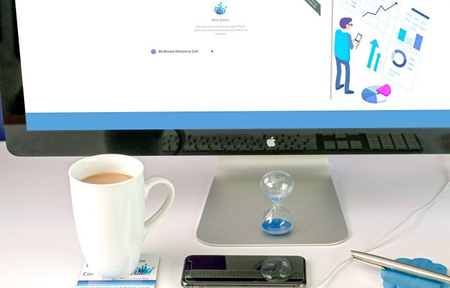 tea and sand timer on a computer