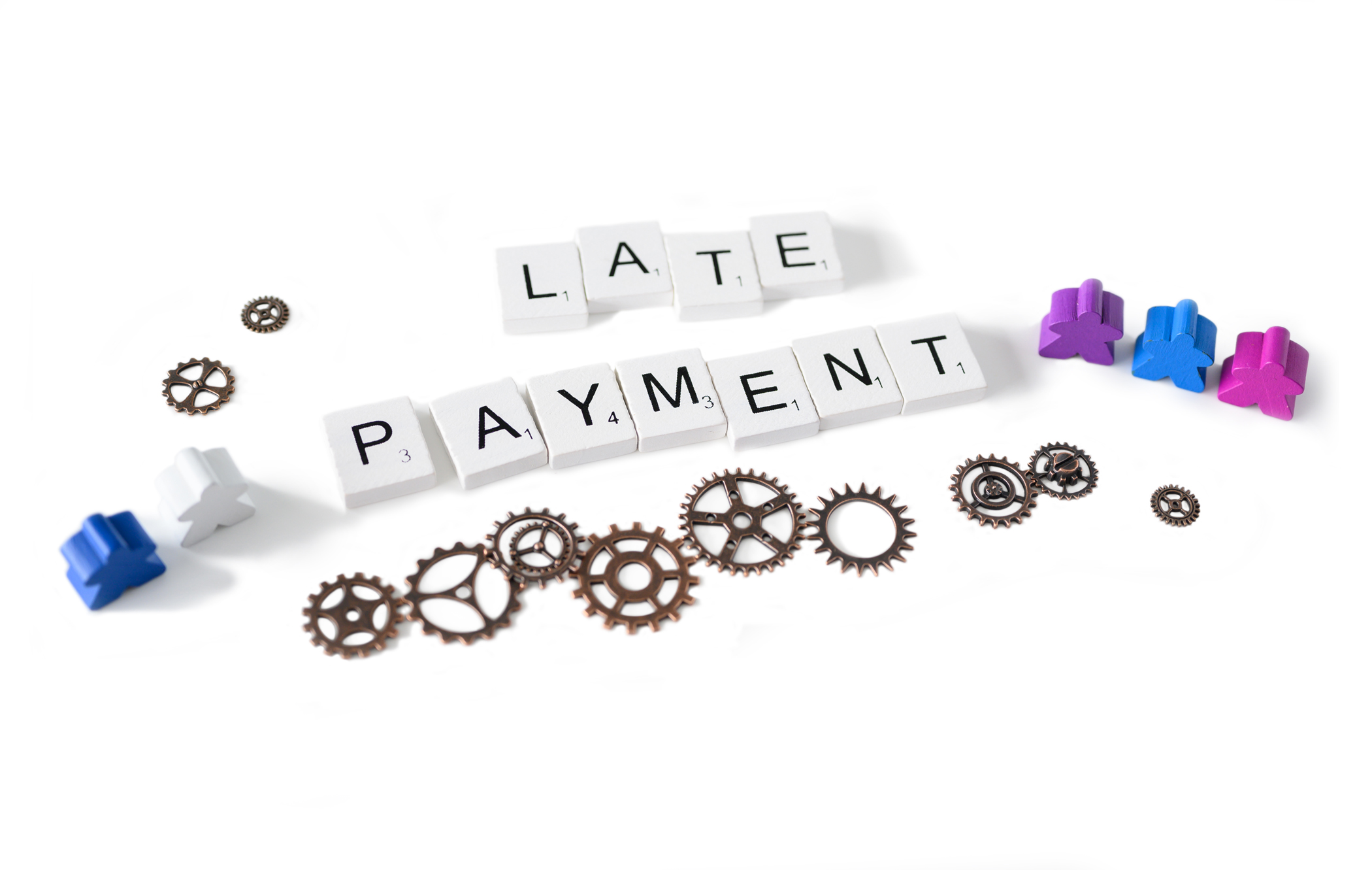 Late Payment written out in letter times with cogs to represent processes and meeples to represent people.